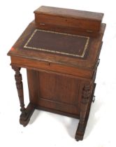 A Davenport desk. With hinged lid and four drawers to the right hand side.