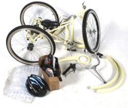 A Scout folding step through tri-cycle. 24 inch frame, with accessories. Part assembled.