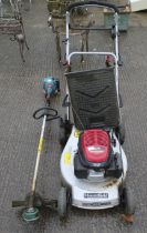 A Mountfield lawn mower and Makita RBC 221 strimmer.