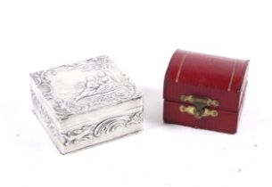 A Dutch silver box and a silver thimble, in a red leather case.