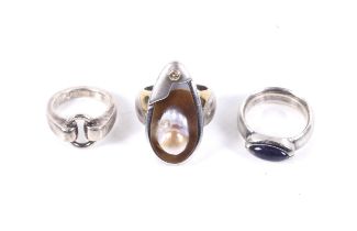 A group of three silver rings.