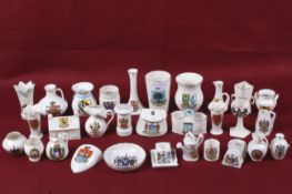 An assortment of vintage crested chinaware. Including vases, jugs, dishes, etc.