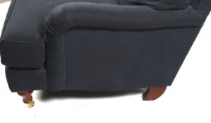 A contemporary Howard style double seat sofa. In navy blue upholstery.