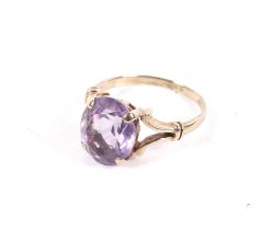 A vintage 9ct gold and oval amethyst single stone ring.