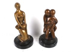 A pair of bronze figures.