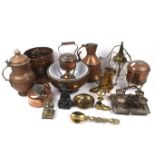 A collection of assorted copper and brassware.