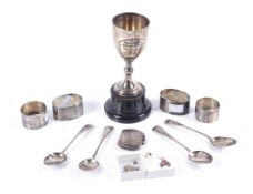 A collection of silver and jewellery to include a silver trophy goblet.