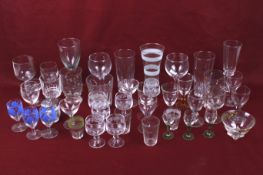 A large assortment of glassware. Including drinking glasses, dishes and vases, etc. Max.
