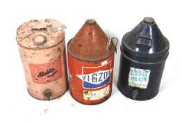 Three vintage oil cans.