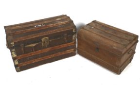Two vintage dome topped travel trunks. Comprising a cast metal example, H43.5cm x W66.5cm x D45.