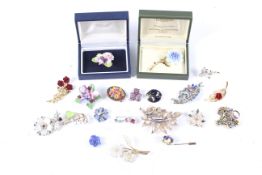A collection of twenty vintage brooches of flowers including examples by Coalport and Harrods