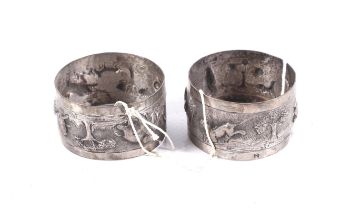 A pair of eastern white metal napkin rings.