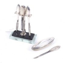 An Art Deco silver mounted and lucite based manicure stand for four pieces.