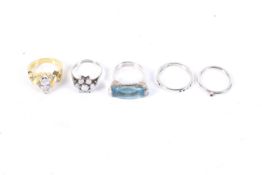 A group of lady's silver and yellow metal rings including a white opal cluster ring.