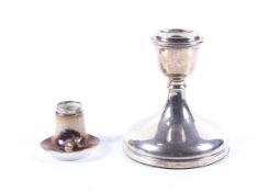 A silver short round candlestick and a silver mounted porcelain small round desk tidy.