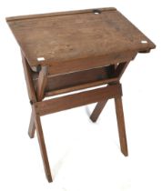 A vintage stained pine folding 'school' desk.