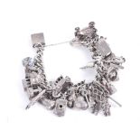 A vintage curb link 'charm' bracelet on a heart-shaped padlock clasp stamped 'Silver'.