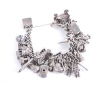 A vintage curb link 'charm' bracelet on a heart-shaped padlock clasp stamped 'Silver'.