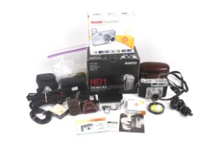 An assortment of digital and film cameras and accessories.