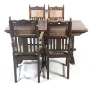 An oak dining table and four chairs.