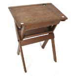 A vintage stained pine folding 'school' desk.