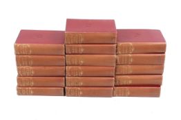 16 volumes of Charles Dickens, Odhams Cheap Edition, in red and gilt binding.
