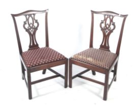 A pair of 20th century Chippendale style dining chairs.