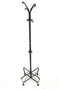 A mid-century black metal coat stand.