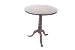 A Victorian mahogany tilt-top table. On a turned column with tripod support, H73.