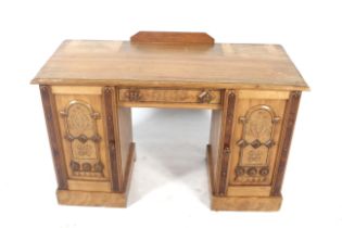 A vintage 'Puginesque' Gothic style twin pedestal desk.