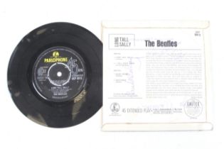 A Beatles 'Long Tall Sally' vinyl single record with the signatures of all four band members.