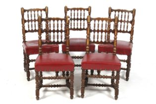 A set of five wooden chairs.