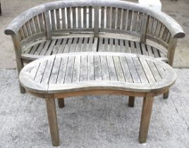 Hardwood curved garden bench and matching table.