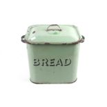 A vintage green enamel bread bin.