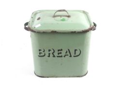A vintage green enamel bread bin.
