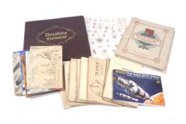 A collection of vintage trading card albums and contents.