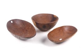 Three handmade wooden bowls and dishes. Two with carved decoration, Max.