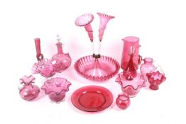An assortment of 19th century and later cranberry glassware.