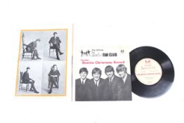 A Beatles fan club record and a vintage tour program.