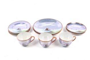 A 20th century Japanese three-piece tea service. Decorated with boats in a lustre glaze.