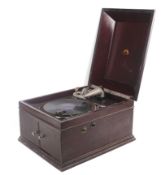 A vintage His Master's Voice table top wind up gramophone record player.