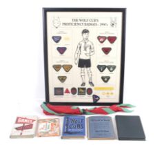 An assortment of 1950s scouting items. Including framed badges, 50cm x 40cm, books, scarves, etc.