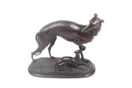 A bronzed figural group after P J Mene of a greyhound watching over her pup.