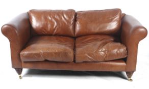 A brown leather 'Camborne' two-seater sofa.