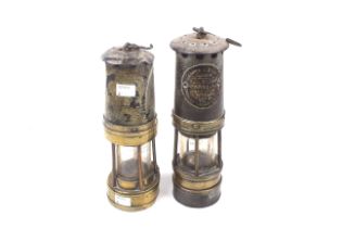 Two late 19th/early 20th century brass and iron miners lamps.