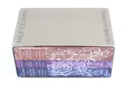 A boxed set of signed first edition trade paperbacks of Philip Pullman's 'His Dark Materials'
