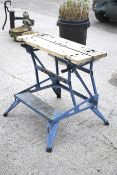 A Black & Decker Workmate folding work bench. Mounted on a blue metal stand, H76.
