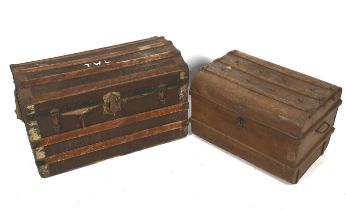 Two vintage dome topped travel trunks. Comprising a cast metal example, H43.5cm x W66.5cm x D45.