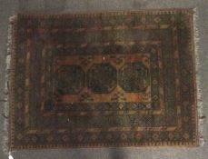 An early 20th century small Persian carpet.