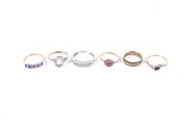 A group of six various gem set rings including four in 9ct gold.